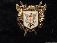 Front view of the British crest pin highlighting detailed enamel and gold-tone metal work.