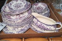 Boxed lot showing stacks of Old Hall Ware Bristol pattern plates alongside a gravy boat