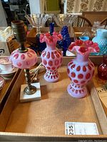 Two vases and lamp base displayed on cardboard tray