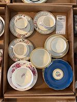 Top-down photo showing 7 saucers (6 matching Royal Bayreuth) and one teacup.