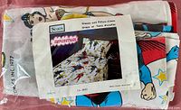 Original packaged vintage DC Comics superhero single bed sheet set showing colorful print featuring Batman, Superman, and Wonder Woman.