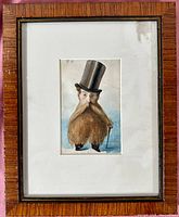 Full frontal view of framed watercolor caricature mounted on white mat inside wood frame with gold inner edge