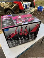 Box front showing the Big Red 2 Ton Trolley Jack, two Jack Stands, and 2 Piece Creeper combo images and details.