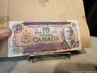 Obverse of the $10 Canadian banknote showing the portrait of Sir John A. Macdonald and the denomination.