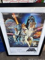 Frontal view of entire framed poster showing artwork and frame