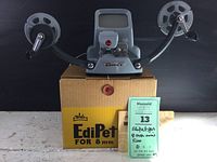 Full view of the Walz Edipet 8mm film viewer mounted on original box with hand crank reels on each side and a viewing lens with screen.