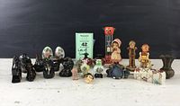 Full view of lot showing all small collectibles including red ware animals, Anri figures, cloisonné eggs, hourglass timer, small ceramics and figurines