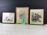 Photo of three framed black and white prints placed side by side showing overall look and frame styles.