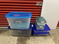 Photo showing 4 stacked storage containers including 2 large containers and 2 smaller tubs