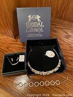 Bridal Classics branded box with necklace and matching earrings, and separate bracelet.