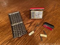 Full view of all items in the lot on wooden floor.