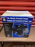 Damaged cardboard box labeled Power Fist 1 in. Water Transfer Pump, front view with product image and specifications.