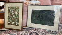 Both framed artworks shown side by side. Floral watercolor painting on left, Remington print on right.