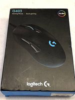 Front of Logitech G403 gaming mouse retail box showing branding, image of mouse, and RGB lighting feature.