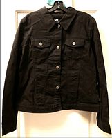 Front view of the new black women's jacket by Lee with button closure and chest pockets