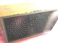 Photo of the LED traffic light showing the front panel with three circular LED sections visible