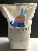 Front view of the sealed Pretty Litter bag showing cat graphic and features.