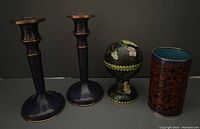 Photo showing the full set of cloisonné items including two candle holders, one domed container, and one pencil holder on a dark background.