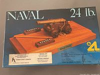 Original box for the 24 lb Naval Cannon model kit showing assembled cannon on wooden base.
