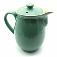 Front view of green Denby stoneware pitcher with lid and handle showing spout and lid top with vent hole.