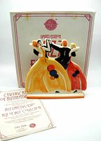 Photo of the Double Dancers figurine with original box and certificate of authenticity showing the design and condition of the item.