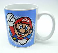 White ceramic mug with Mario graphic on blue background, with Mario raising his fist.