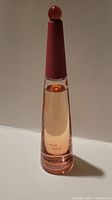 Front view of Issey Miyake Rose & Rose cologne bottle showing its shape and liquid level.