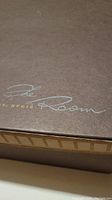Photo of The Room St. Regis branding on box, indicating origin.