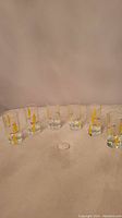 Full set of six vintage shot glasses showing all the glasses in a row