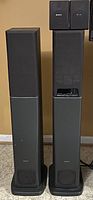 Four piece Sony speaker set including two tall tower speakers and two small surround sound speakers