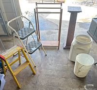 Full lot overview showing 2 step stools, drying rack, wooden pedestal, and 2 plastic containers.