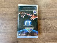 Front view of sealed E.T. The Extra-Terrestrial VHS tape showing cover art and price sticker.
