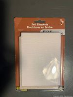 Front view of package showing white felt pad labeled 'Felt Blankets' size 4 1/2 x 6 inches with Velcro logo.