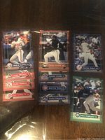 Photo showing stacked sports cards of Vladimir Guerrero, Mark McGwire, Pedro Martinez, Ken Griffey Jr.