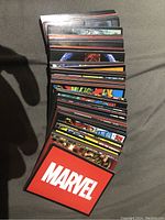 Full view of the colorful Marvel 80th Anniversary stickers showing a stack of rectangular stickers with various characters and the Marvel logo on the back.