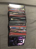 Stack of Marvel sticker packs showcasing various characters including Black Panther on the front visible pack.