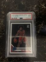 Front view of the 2019 Panini Donruss Optic Coby White rookie basketball card in a PSA graded protective case showing the player image and card details.