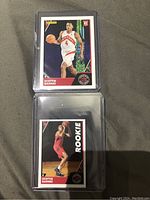 Front of Scottie Barnes rookie basketball card and rookie sticker in protective sleeves.