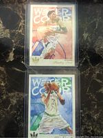 Front view of two NBA watercolor style Court Kings cards featuring Bradley Beal and Kevin Garnett in action poses on the basketball court.