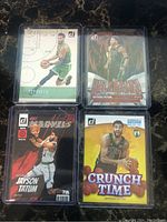 Nine Jayson Tatum Boston Celtics NBA basketball cards including rare and special insert parallels featuring different themes such as Marvels, Unleashed, Splash, Dominators, My House, Crunch Time, and Production Line.