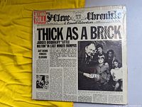 Front of the album cover showing the newspaper-style design with the title 'Thick As A Brick' and band name Jethro Tull prominently featured.