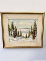 Front view of the framed winter landscape oil painting showing signature and matting.