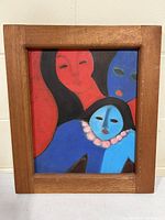 Front view of framed oil painting on canvas showing three abstract human faces in vivid colors, signed 'KOSIO'. Wood frame visible with natural finish.