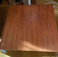 Top down view of the wooden coffee table showing the wood grain and smooth surface.