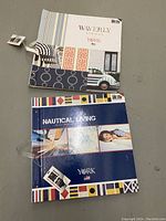 Two scrapbooks placed flat, showing Waverly and Nautical Living covers.