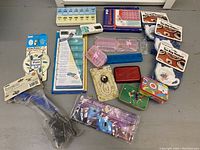 Overview of the lot including various pill boxes, tea bag holders, and small storage containers.