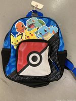 Front view of the blue Pokémon book bag showing the characters and Poké Ball pocket.