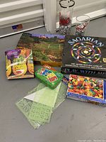 Overview photo showing all games, puzzles, stencils, and glasses in the lot