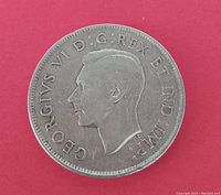 Obverse side of the 1944 Canadian silver 50 cent coin showing King George VI's portrait and inscription.