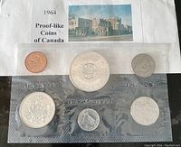 1964 Canadian Proof-like Coin Set displayed in original sealed plastic holder with certificate showing building picture and title.